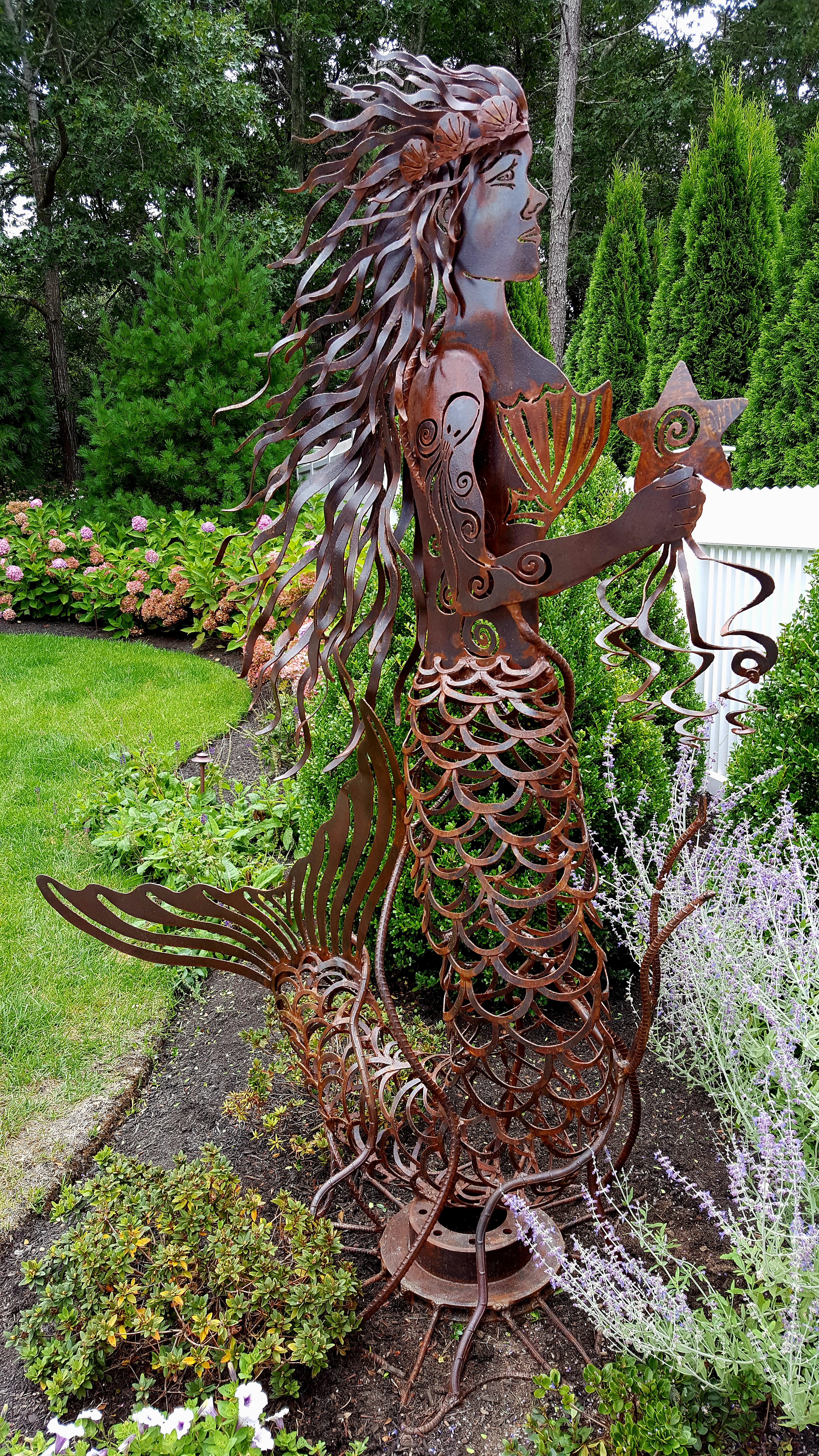 Metal mermaid sculpture