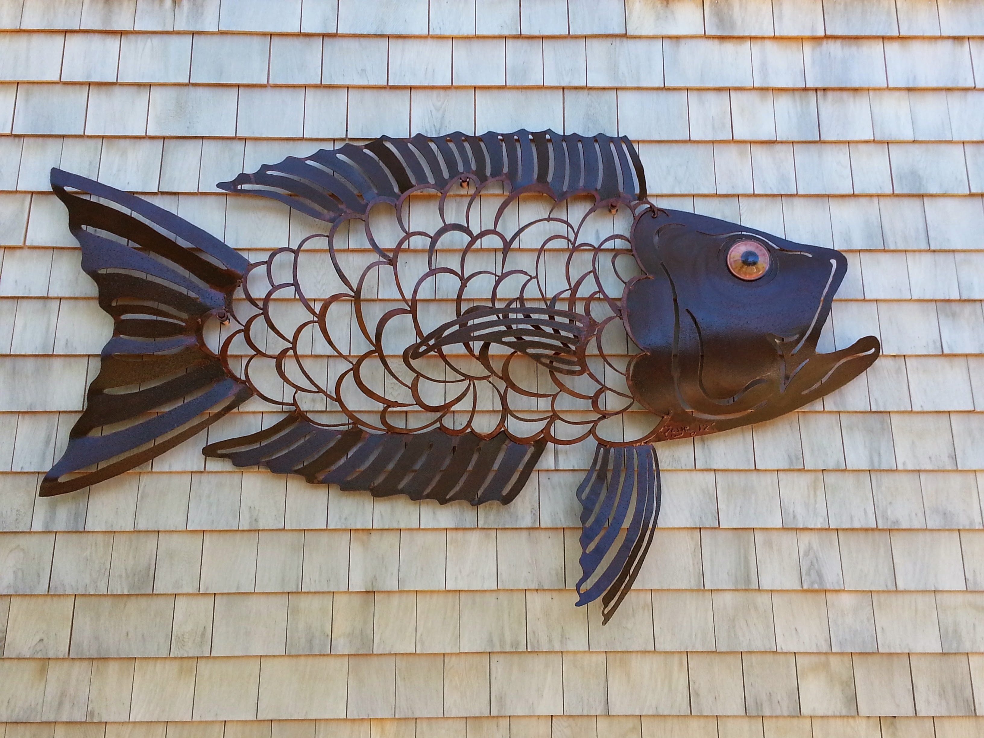 Fish with see-through scales sculpture